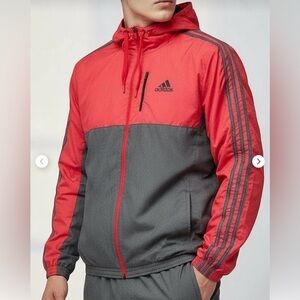 Adidas Men's Essential Woven Windbreaker Tracksuit Jacket in red and gray.